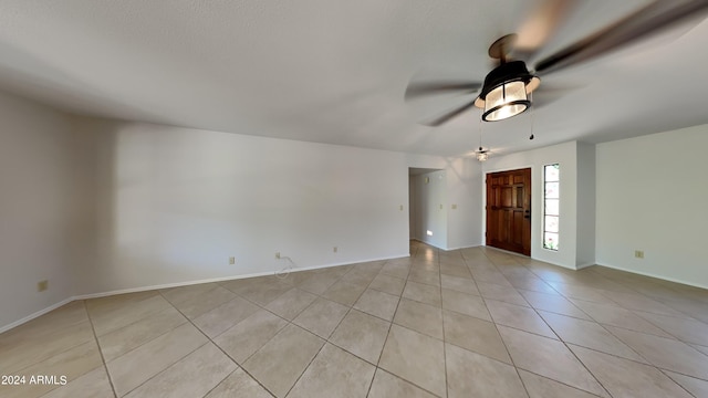 entrance foyer featuring ceiling fan and light tile patterned floors