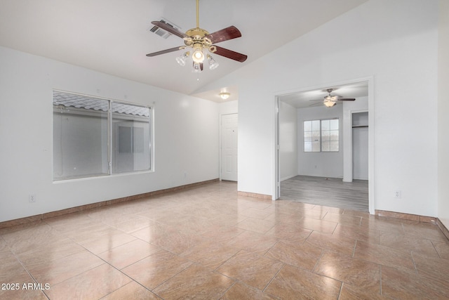 spare room with high vaulted ceiling and ceiling fan