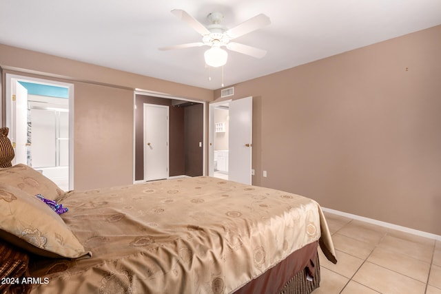 tiled bedroom featuring ceiling fan