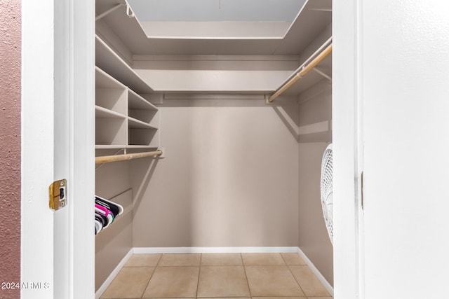 walk in closet featuring light tile patterned floors