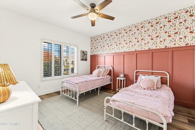 bedroom featuring wood-type flooring and ceiling fan