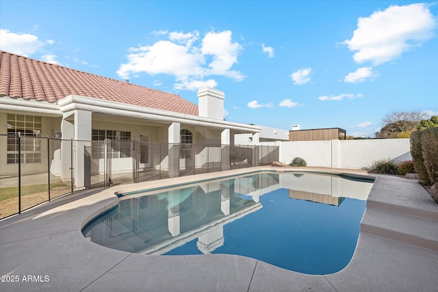 view of swimming pool with a patio