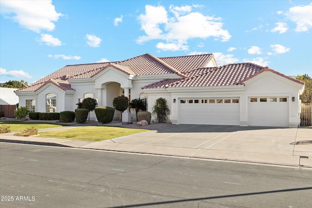 mediterranean / spanish-style home featuring a garage