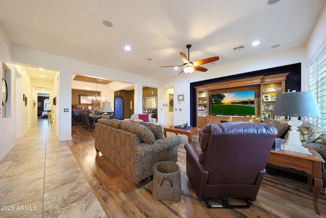 19334 W Pasadena Ave, Litchfield Park, AZ 85340 - living room featuring a chandelier, a ceiling fan, recessed lighting, light wood-style flooring, and baseboards