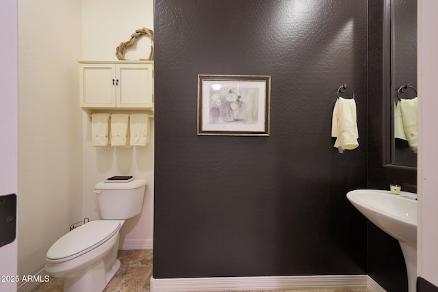 19334 W Pasadena Ave, Litchfield Park, AZ 85340 - bathroom featuring toilet and baseboards
