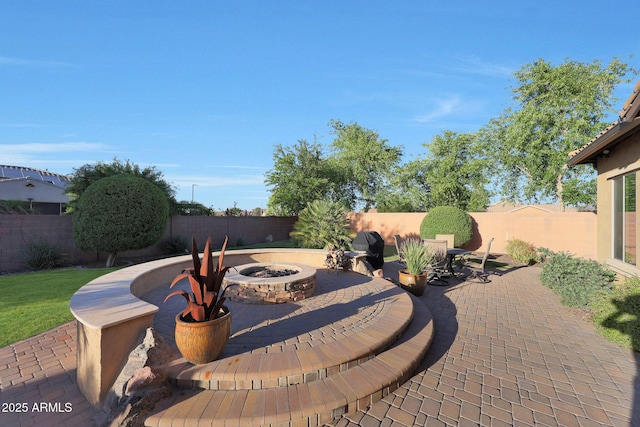 19334 W Pasadena Ave, Litchfield Park, AZ 85340 - view of patio / terrace featuring a fire pit and a fenced backyard