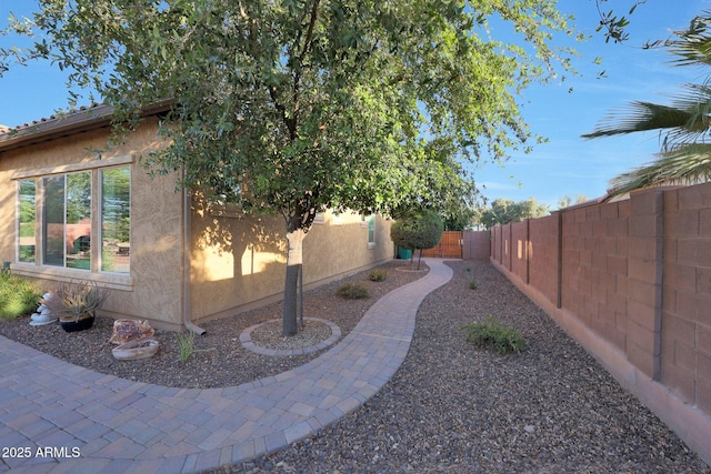 19334 W Pasadena Ave, Litchfield Park, AZ 85340 - view of home's exterior with a fenced backyard and stucco siding