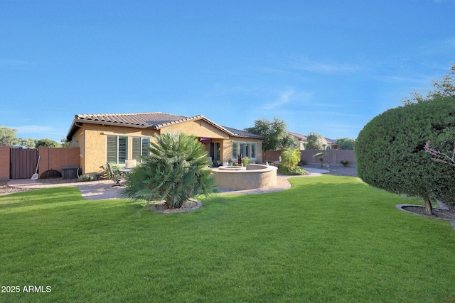 19334 W Pasadena Ave, Litchfield Park, AZ 85340 - rear view of house with stucco siding, a patio area, and a tiled roof
