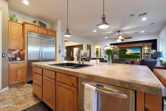 19334 W Pasadena Ave, Litchfield Park, AZ 85340 - kitchen featuring open floor plan, stainless steel appliances, a sink, ceiling fan, and recessed lighting