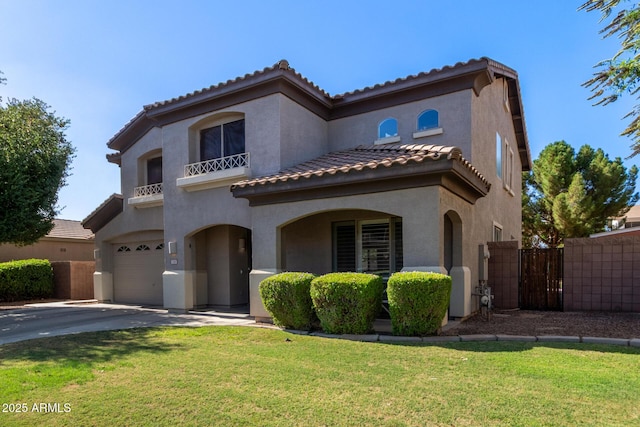 1342 E Jade Dr, Chandler, AZ 85286 - mediterranean / spanish home featuring a garage, a tiled roof, stucco siding, asphalt driveway, and a balcony