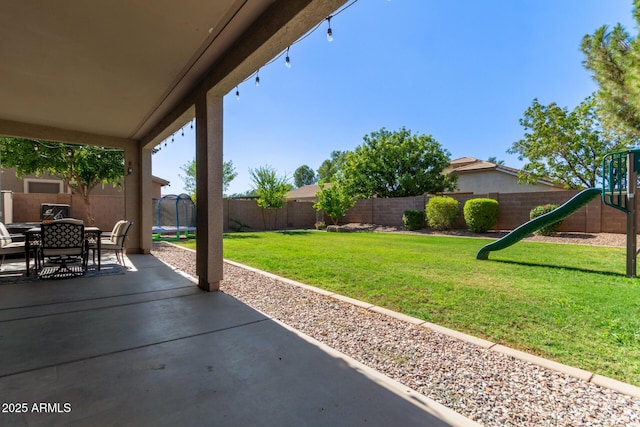 1342 E Jade Dr, Chandler, AZ 85286 - fenced backyard with a patio area, a playground, and outdoor dining area