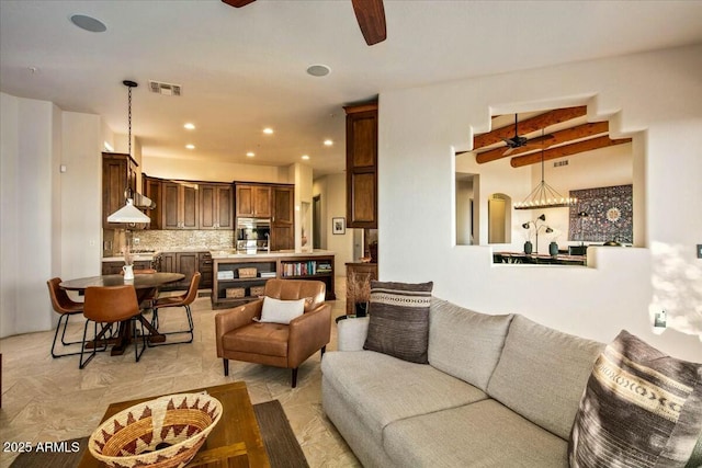 living room featuring visible vents, a ceiling fan, and recessed lighting