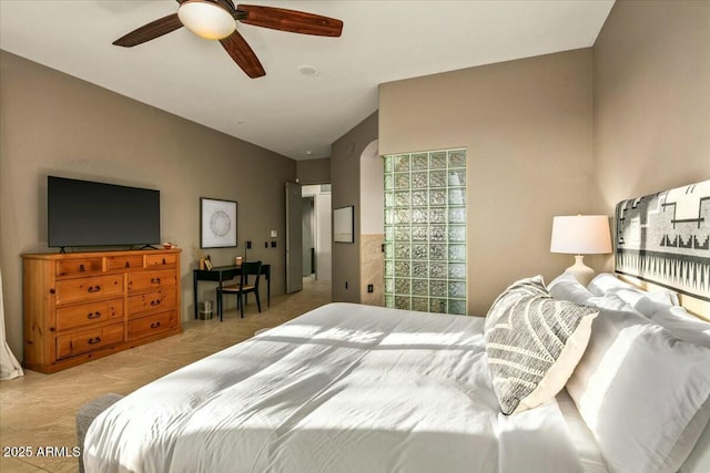 bedroom with lofted ceiling and ceiling fan