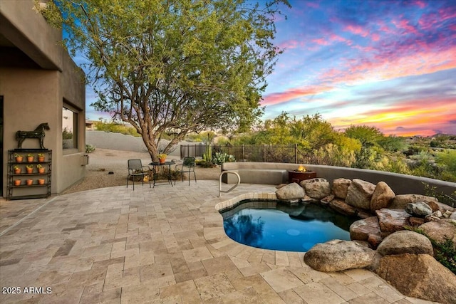 view of pool featuring a fenced in pool, a fenced backyard, and a patio