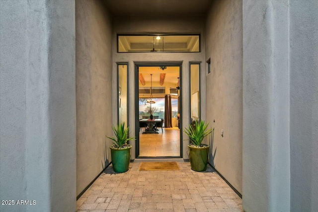 doorway to property with stucco siding