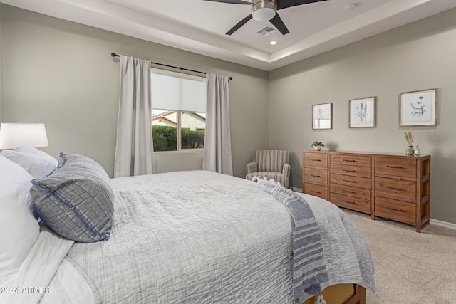 bedroom featuring ceiling fan and light carpet