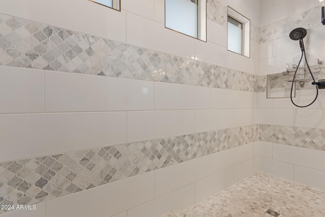 bathroom featuring tiled shower