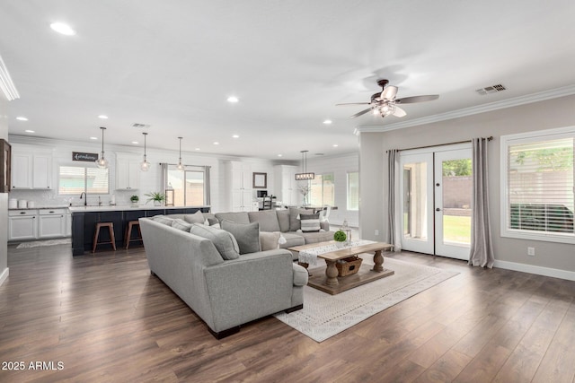 6317 S Banning St, Gilbert, AZ 85298 - living room featuring dark wood-style flooring, crown molding, a ceiling fan, and recessed lighting