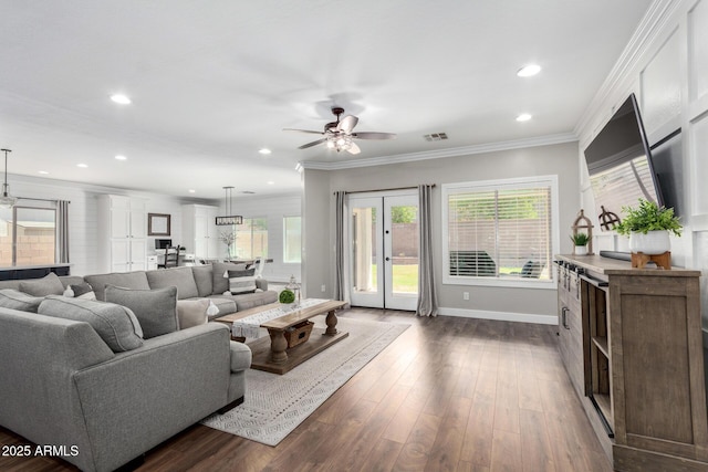 6317 S Banning St, Gilbert, AZ 85298 - living room with a ceiling fan, crown molding, dark wood-type flooring, recessed lighting, and french doors