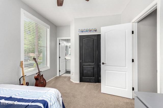 6317 S Banning St, Gilbert, AZ 85298 - bedroom featuring light colored carpet, ensuite bathroom, and ceiling fan