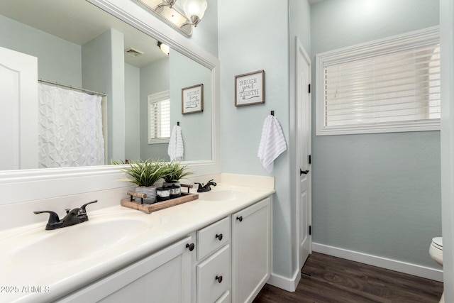 6317 S Banning St, Gilbert, AZ 85298 - bathroom featuring double vanity and wood finished floors