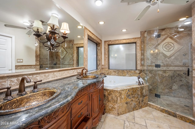 bathroom featuring vanity, separate shower and tub, and ceiling fan with notable chandelier