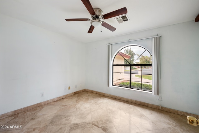 spare room featuring ceiling fan