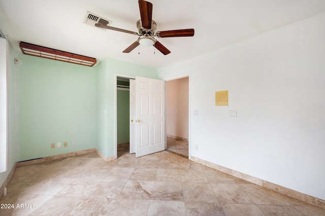 unfurnished bedroom featuring ceiling fan