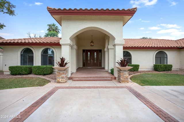 property entrance featuring french doors