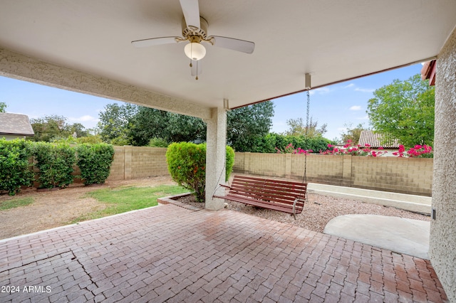 view of patio featuring ceiling fan