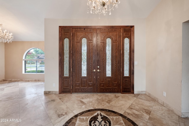 foyer with an inviting chandelier