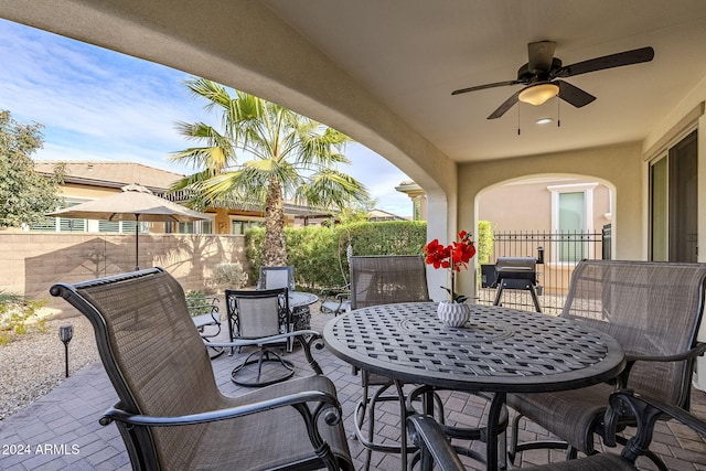 view of patio / terrace featuring ceiling fan