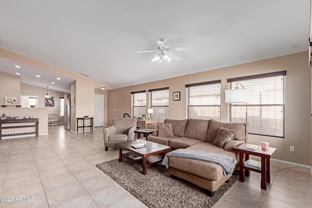 12787 S 175th Ave, Goodyear, AZ 85338 - living room featuring light tile patterned floors, recessed lighting, a ceiling fan, and vaulted ceiling