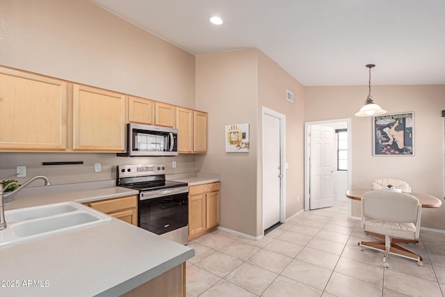12787 S 175th Ave, Goodyear, AZ 85338 - kitchen with light brown cabinets, appliances with stainless steel finishes, light countertops, and a sink