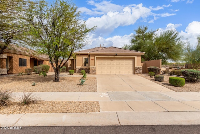 12787 S 175th Ave, Goodyear, AZ 85338 - view of front of house with stucco siding, a tile roof, stone siding, concrete driveway, and an attached garage