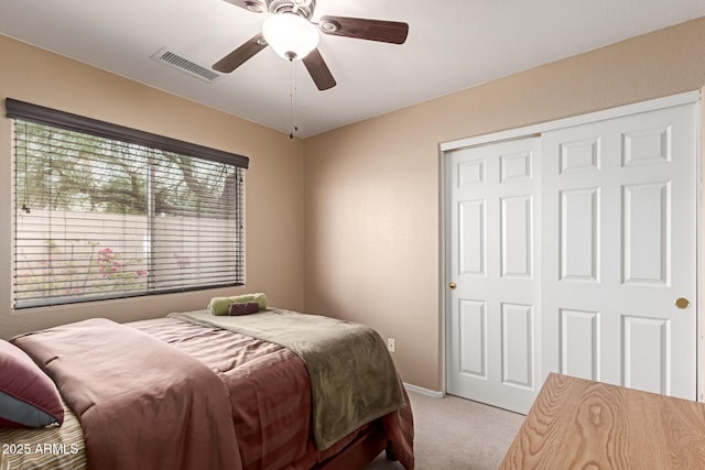 12787 S 175th Ave, Goodyear, AZ 85338 - bedroom featuring visible vents, a closet, carpet flooring, baseboards, and ceiling fan