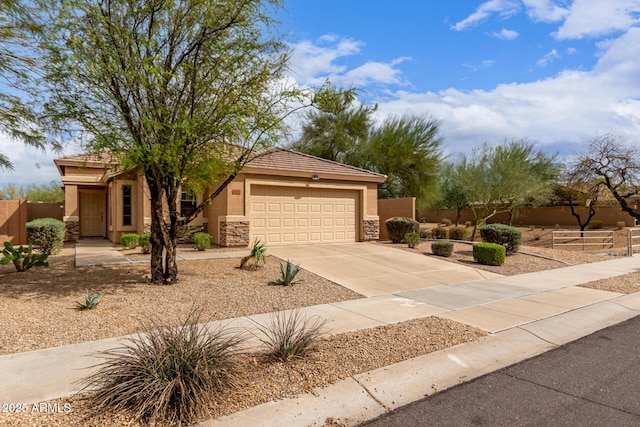 12787 S 175th Ave, Goodyear, AZ 85338 - view of front of home featuring fence, a garage, driveway, and stucco siding