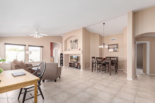 12787 S 175th Ave, Goodyear, AZ 85338 - living area with visible vents, arched walkways, ceiling fan with notable chandelier, and vaulted ceiling