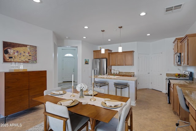 dining area with baseboards, light tile patterned floors, visible vents, and recessed lighting