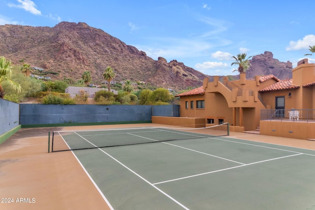 view of tennis court with a mountain view