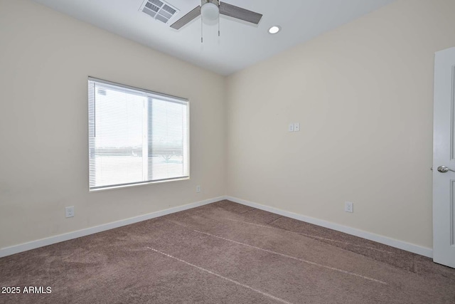 carpeted empty room featuring ceiling fan