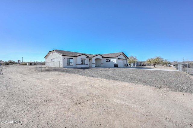 single story home with a garage