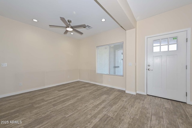 foyer entrance featuring ceiling fan and wood-type flooring