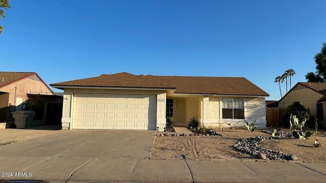 single story home featuring a garage