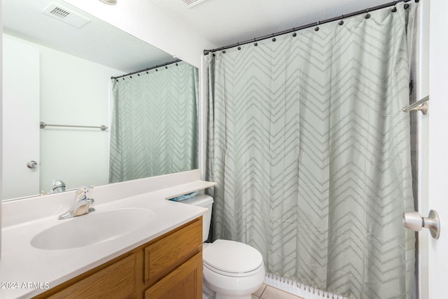 bathroom with vanity, toilet, a textured ceiling, and a shower with curtain