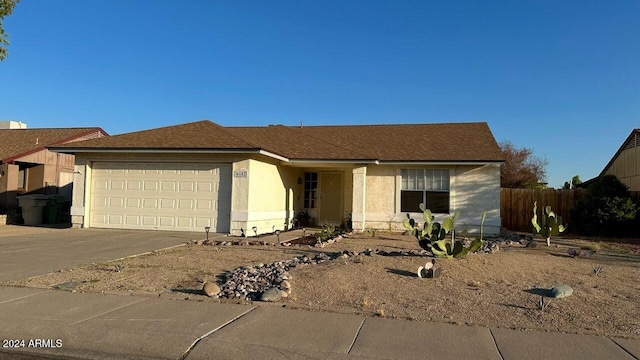 ranch-style home featuring a garage