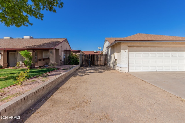 view of property exterior with a garage