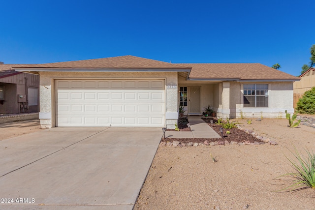 single story home featuring a garage