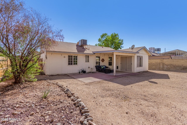 back of house with a patio