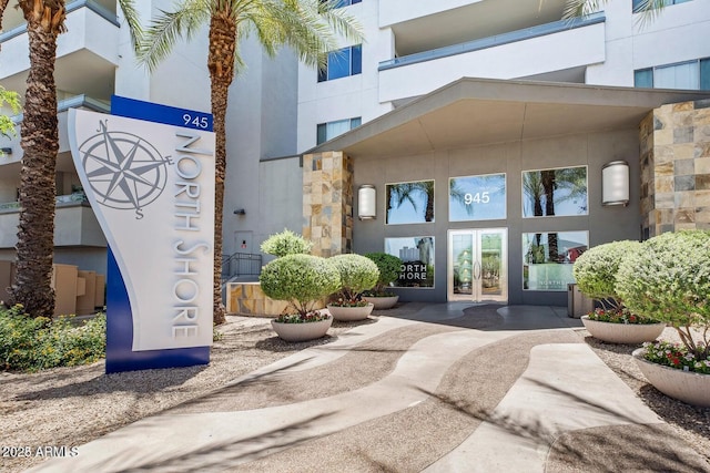 property entrance featuring french doors and stucco siding